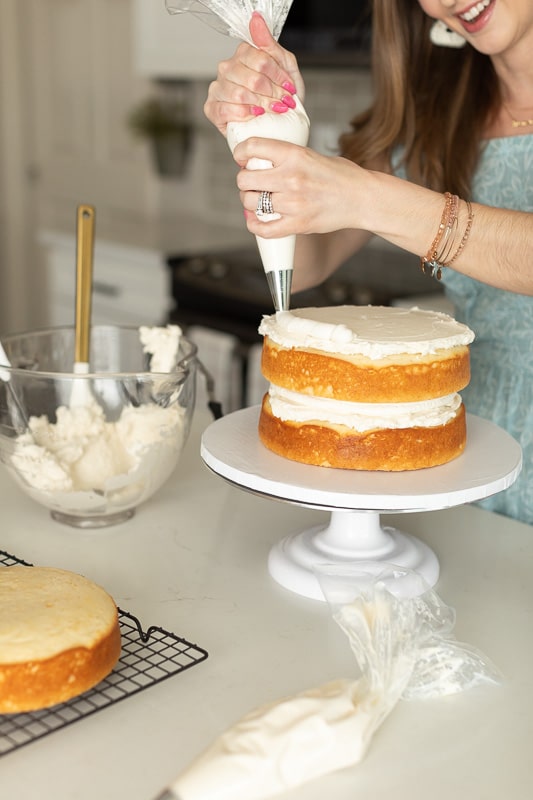 The Campbell Cakery, LLC decorating a cake